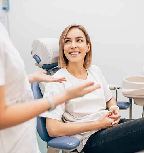 Dentist talking to a patient