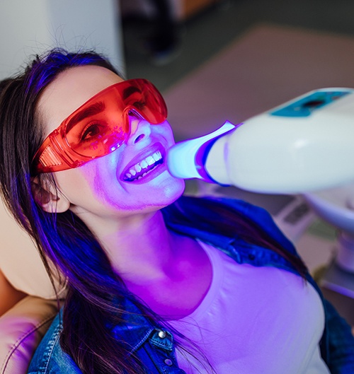 Woman having her teeth whitened