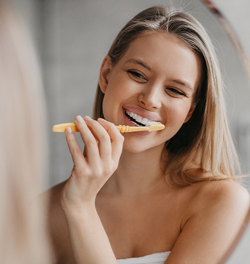 Woman brushing her teeth